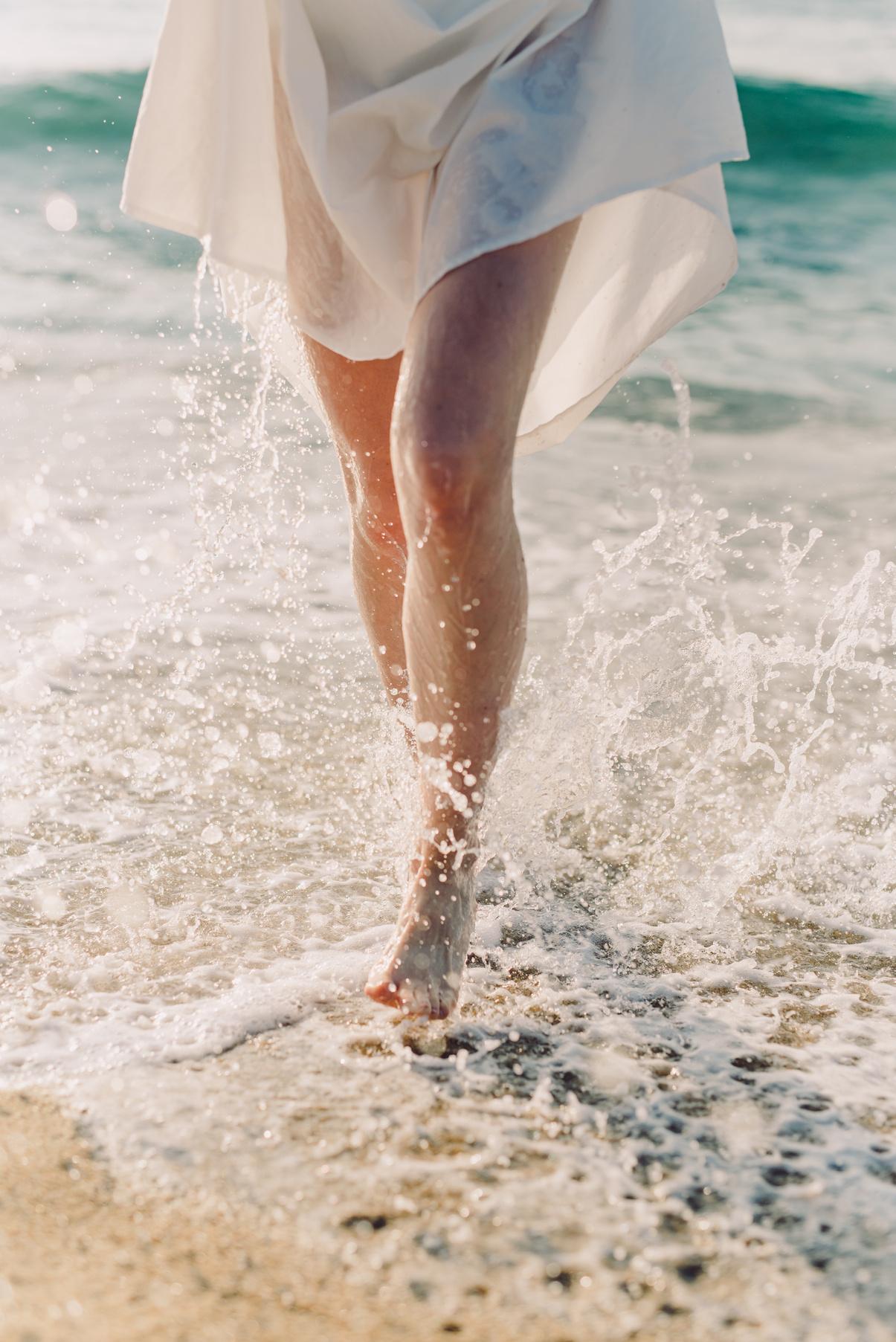 Woman Walking on Seashore